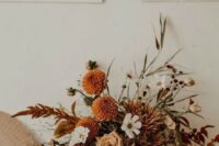 51 a beautiful boho fall wedding centerpiece of white, rust, neutral blooms, bold foliage, greenery is a very refined idea to rock