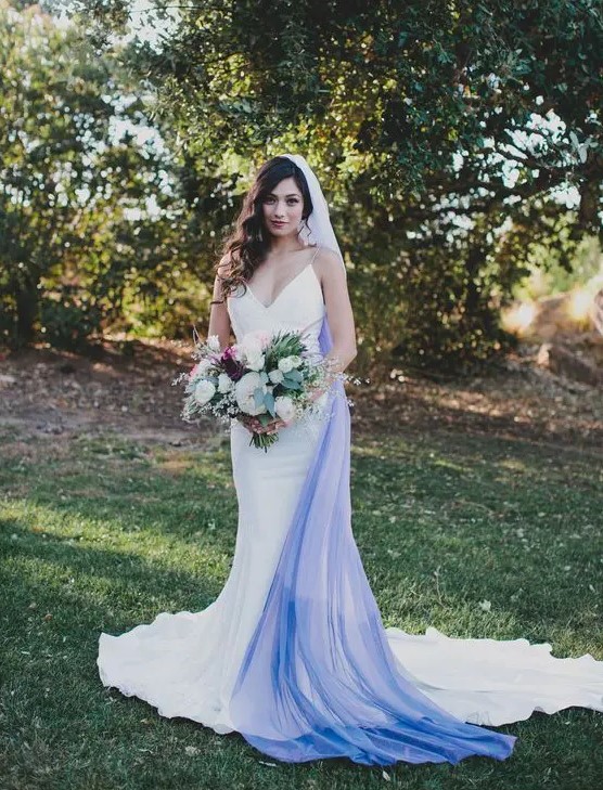 a modern plain mermaid wedding dress with spaghetti straps and an ombre white blue veil for a bold look