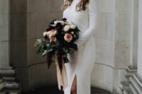 55 a modern and classic plain wedding dress with a high neckline, long sleeves, a slit and a train is a gorgeous idea for a modern wedding