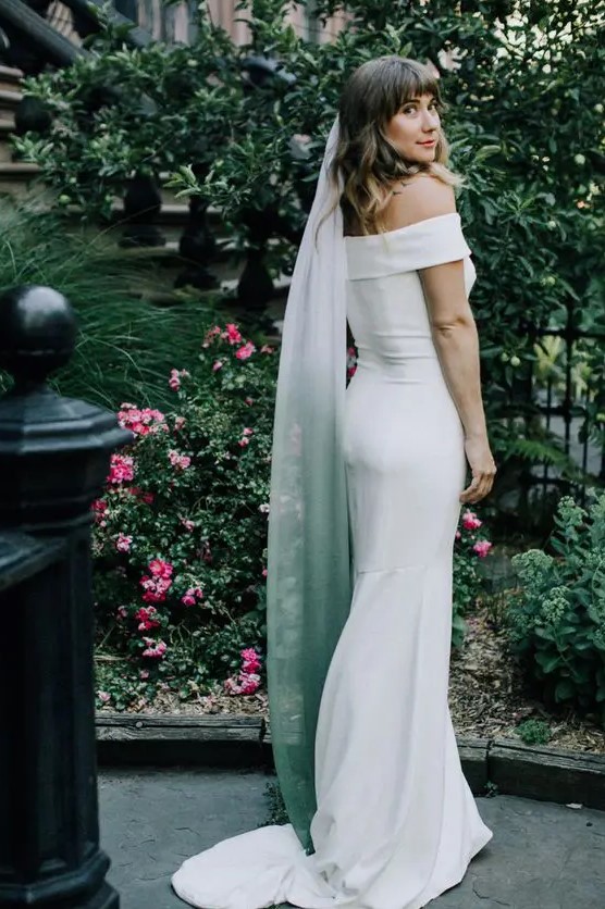 a modern plain off the shoulder mermaid wedding dress plus an ombre white to green veil for a touch of color and a modern twist