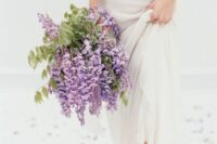 57 a spring wedding bouquet of wisteria and greenery is a cool idea for a relaxed and romantic summer wedding