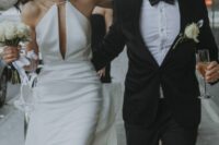 58 a modern halter neckline wedding dress with a cutout and slits ont he skirt is a modern or minimalist wedding idea