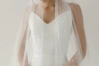 58 a modern wedding dress paired with a delicate silver flake veil create a stylish modern bridal look with a shiny touch