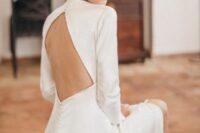 63 a modern plain wedding dress with a rhomb cutout back and long sleeves plus a row of buttons is a lovely and chic idea