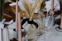 67 a modern cluster wedding centerpiece of colorful bunny tails, wheat and blush candles is ideal for a modern rustic wedding