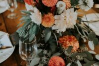 68 a pretty fall wedding centerpiece of white and blush dahlias, orange mums, greenery and grasses is a lovely idea for a boho wedding