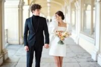 70 a trendy mini wedding dress – a plain one with oversized puff sleeves, neutral shoes and a cool updo for a retro-inspired look