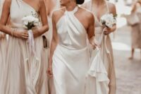 71 an effortlessly chic plain wedding dress with a halter neckline, a draped bodice and a skirt with a train is pure chic