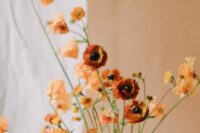 75 a sophisticated fall wedding centerpiece of orange poppies and some rust ranunculus is a beautiful fine art wedding idea