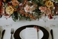 76 a stylish modern fall wedding tablescape with a black charger, black cutlery, lovely blush, peachy, rust and yellow blooms and greenery