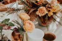 83 bold boho fall wedding centerpieces of orange, blush and rust blooms, greenery, bold foliage and candles around are cool