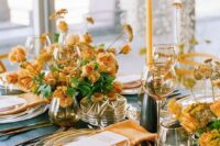 84 bright fall wedding centerpieces of buttermilk blooms and greenery with some dried elements, matching candles and napkins