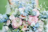 a beautiful and textural pink and blue wedding bouquet with plenty of greenery for texture is a cool idea