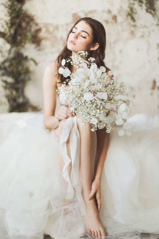 a beautiful baby's breath and lunaria wedding bouquet for an airy feel and a unique look