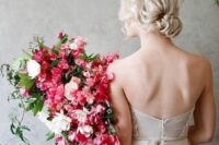 a bold wedding bouquet of bougainvillea, white blooms and greenery including cascading touches for a colorful summer wedding