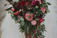 a bold wedding bouquet of pink peonies, burgundy dahlias, an artichoke, greenery, berries and amaranthus is a cool fall wedding idea