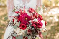 a bold wedding bouquet of red and burgundy roses and dahlias, white hydrangeas, amaranthus and eucalyptus is a bold and cool idea