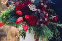 a bold wedding bouquet of red roses and tulips, blue thistles, greenery and amaranthus is amazing for the fall