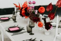 a bold wedding centerpiece of anthurium, dahlias and calla lilies is a catchy idea for a modern wedding