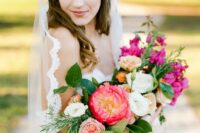 a bright wedding bouquet of bougainvillea, white, peachy and blush blooms, coral peony and greenery