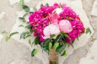 a bright wedding bouquet with bougainvillea, pink peonies and a pink rose is a cool bold idea for a wedding
