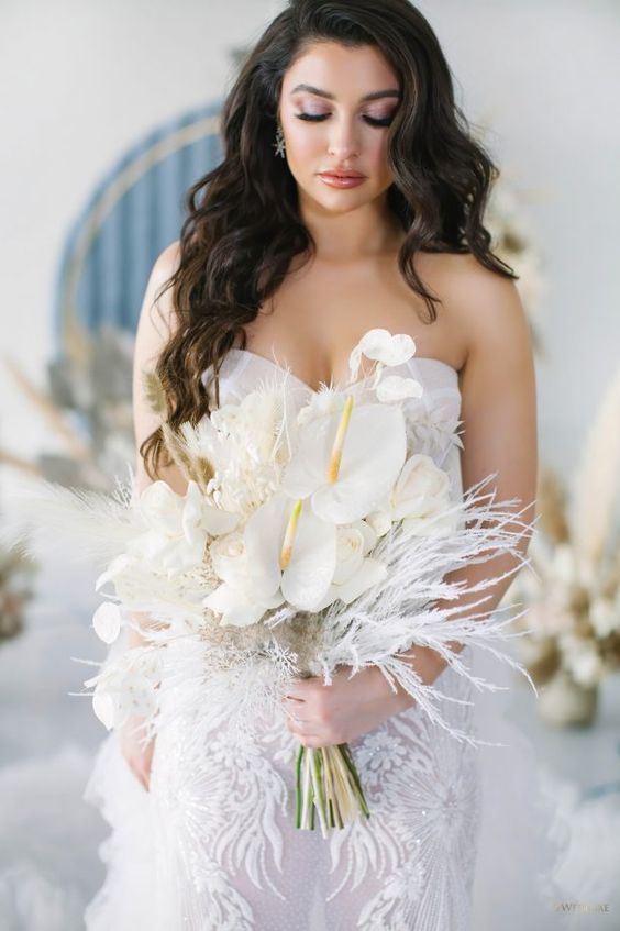 a catchy and glam wedding bouquet of white roses and anthuriums, bunny tails and other grasses is a cool idea for a glam white wedding