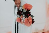 a catchy wedding bouquet of pink anthurium, burgundy roses and baby’s breath is a cool idea for a modern boho bride