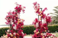 a colorful modern wedding altar of bougainviilea, pink, white peachy and yellow roses looks fabulous and is amazing for summer