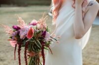 a colorful wedding bouquet of lilac, pink and purple blooms, amaranthus and grasses is a cute pastel-infused idea