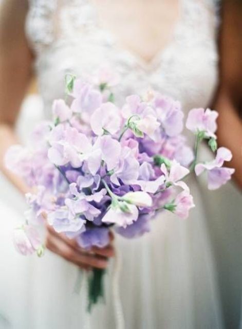 a delicate sweet peas wedding bouquet of soft lilac shades is a cool idea for a spring bride who loves pastels