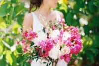 a dreamy wedding bouquet of blush roses and peonies, bougainvillea and greenery for a summer wedding