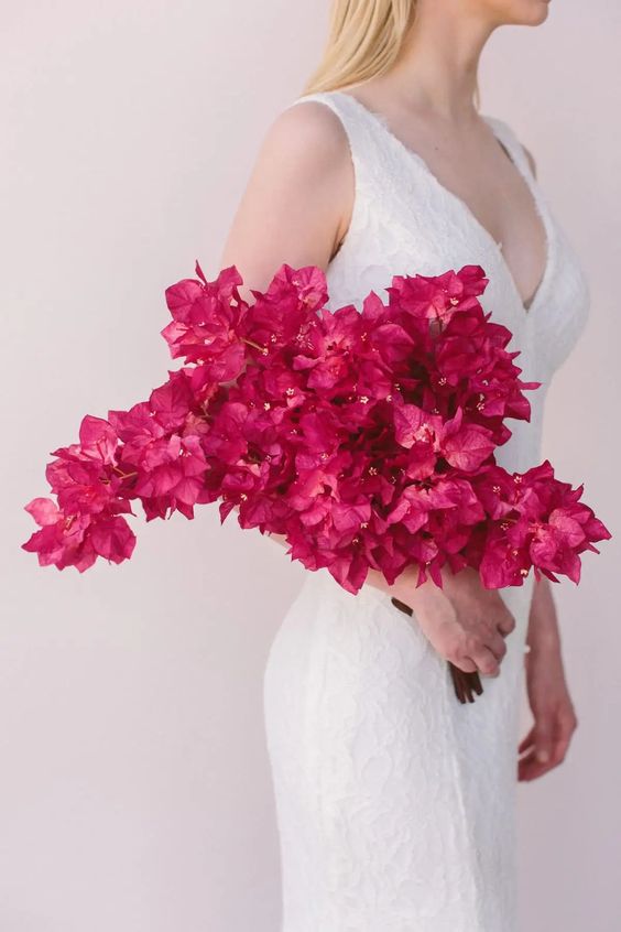 a fantastic mono bougainvillea wedding bouquet is a lush and cool idea for a modern tropical wedding