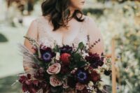 a fantastic wedding bouquet of blush roses, burgundy dahlias and lilies, purple anemones, grasses and amaranthus for a fall or Halloween wedding