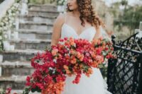 a gorgeous cascading bougainvillea wedding bouquet with some greenery for a lush, flower-infused weddng