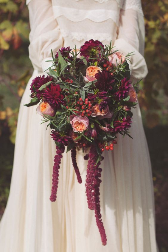 a gorgeous purple wedding bouquet of mums, pink peony roses, berries, greenery and amaranthus for a bright fall wedding