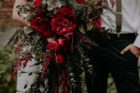 a gorgeous red wedding bouquet of peonies, roses, succulents, greenery, berries and amaranthus is amazing for the fall