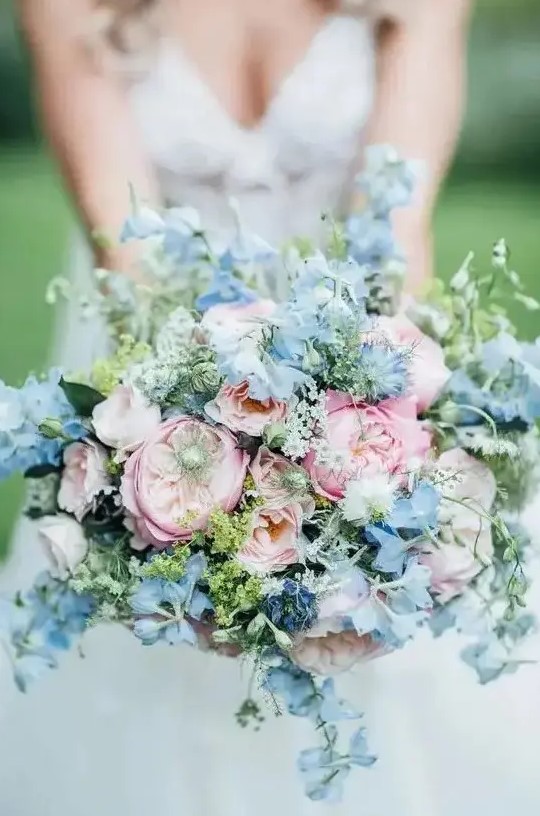 a lovely pink and blue wedding bouquet with peony roses and sweet peas is a gorgeous idea for spring or summer