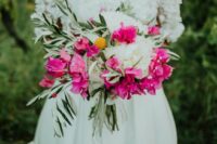 a lovely summer wedding bouquet of white peonies, bougainvillea, billy balls and greenery is a catchy and bold idea