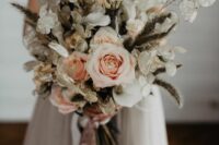 a lovely wedding bouquet of lunaria, blush roses and some grasses is a super catchy and unusual idea for a wedding