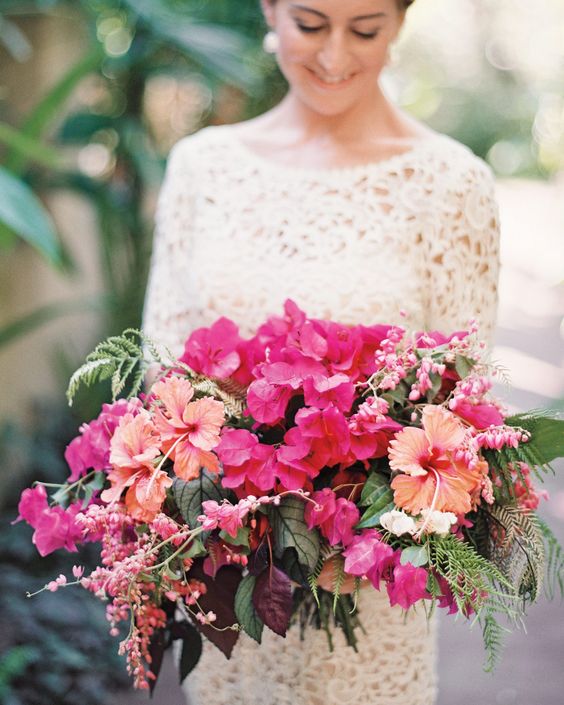 a lush and colorful wedding bouquet of bougainvillea, some tropical blooms and foliage is a stunning idea for a bright summer wedding
