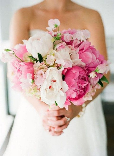 a lush wedding bouquet of white and pink peonies and white and pink sweet peas is a gorgeous idea for spring or summer