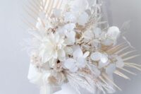a modern white wedding bouquet of lunaria, dahlias, dried grasses and fronds is a cool idea for a modern white wedding