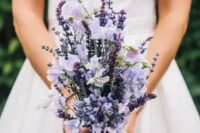 a modest yet catchy wedding bouquet with lilac blooms and lavender is a cool idea for a summer or summer to fall bride