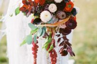 a moody wedding bouquet of burgundy and red mums, greenery, dark foliage and amaranthus is amazing for the fall