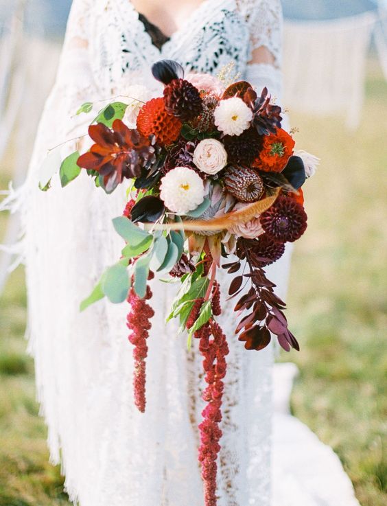 a moody wedding bouquet of burgundy and red mums, greenery, dark foliage and amaranthus is amazing for the fall