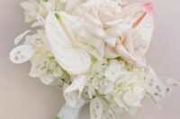 a neutral wedding bouquet of roses, anthuriums, lunaria is a lovely and stylish idea for a modern wedding in white