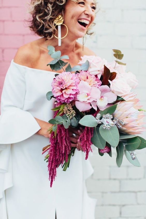 a pink wedding bouquet of roses, orchids, mums, greenery and amaranthus is an amazing idea for a wedding
