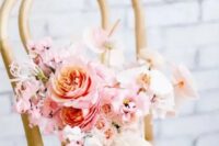 a romantic light pink wedding bouquet with roses and orchids, sweet peas and creamy ribbons is a lovely idea for a Valentine bride