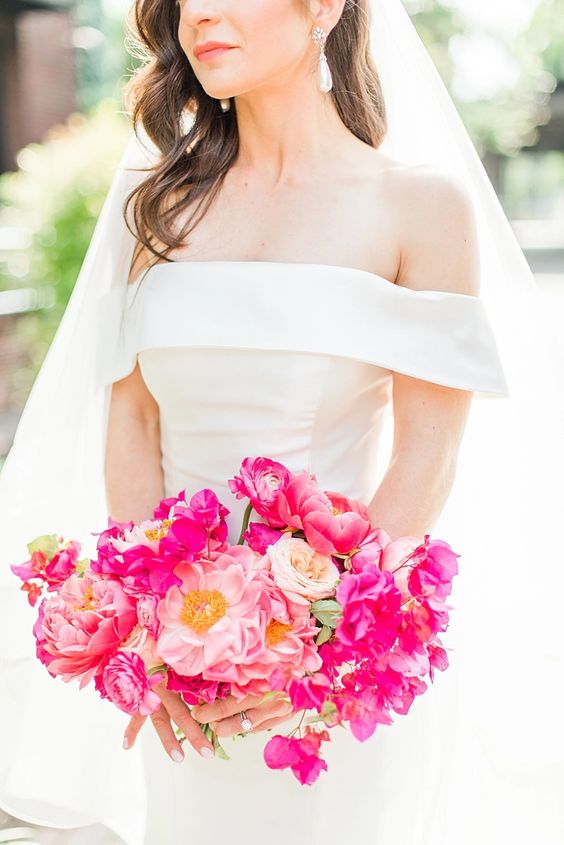 a stylish pink wedding bouquet of pink peonies, ranunculus and bougainvillea is a lovely idea for a modern refined wedding
