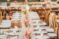 a stylish wedding tablescape with an uncovered table, white porcelain and napkins, anthurium and king proteas is a cool idea